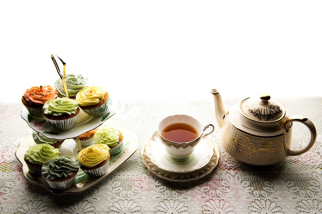 Cake stand, teacup and teapot